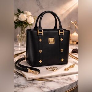 MCM Small Beautiful Black Tote with Gold Accents amazing pre-loved condition.